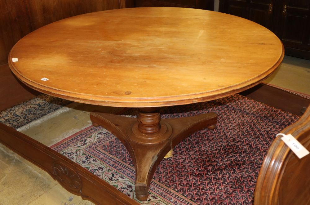 A Victorian pine circular topped dining table, diameter 146cm, H.74cm